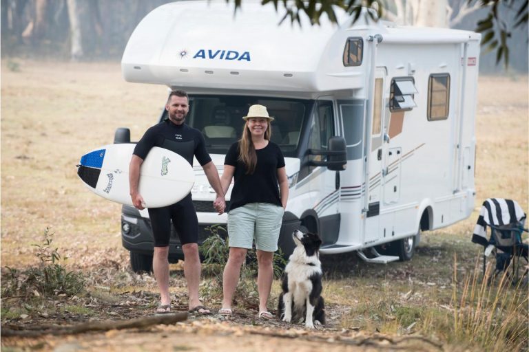 Couple travelling with dog in Avida motorhome