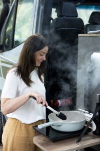 ExplorerLX-lady-cooking-outside-on-hot-plate_