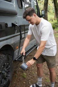 ExplorerLX-man-washing-out-cup-from-outside-tap